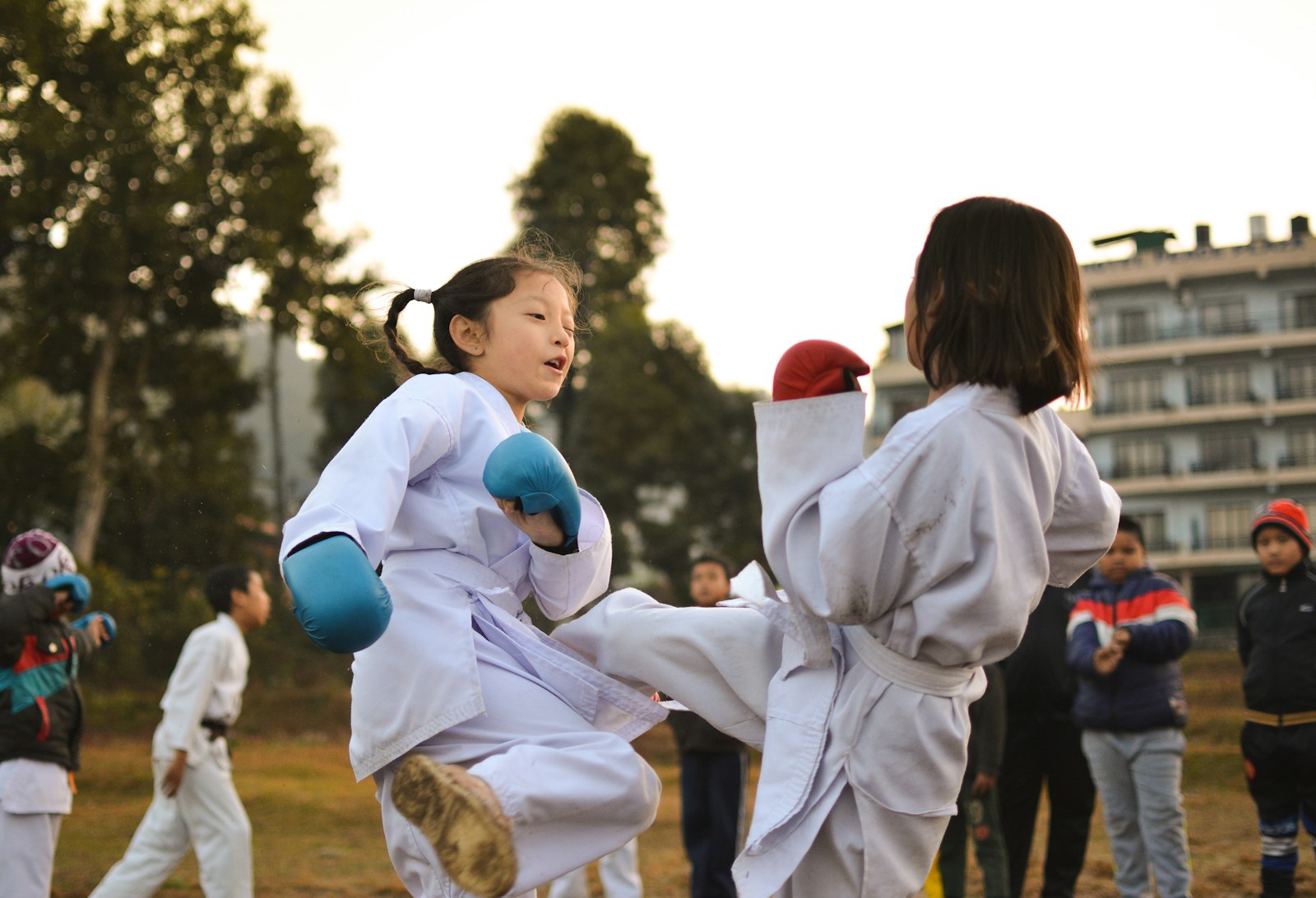 Students mentoring each other in sparring